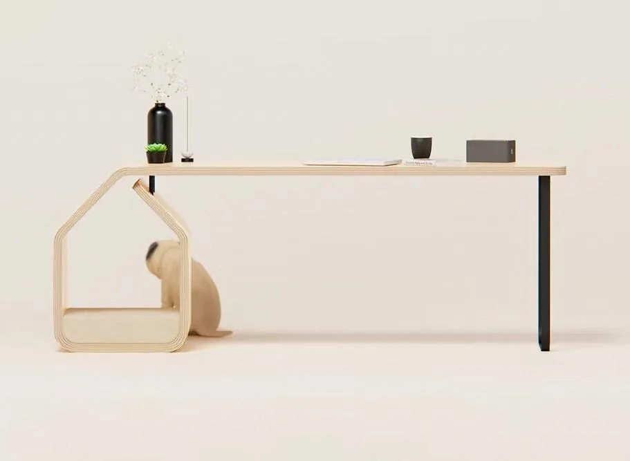 Minimal home office desk with house-shaped pet bed underneath